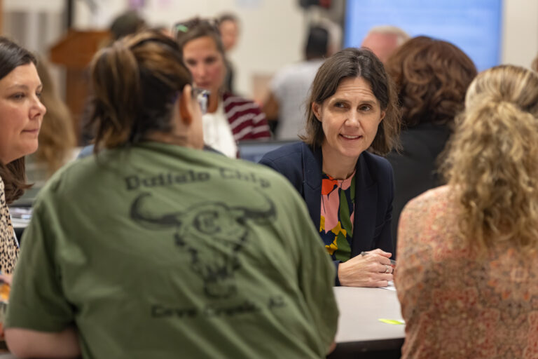 Virginia Superintendent Jenna Conway sits with three women in Gloucester, VA during the 2026 Commonwealth Listening Tour.
